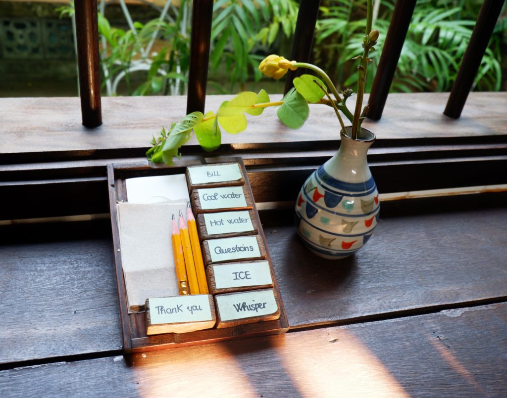 You communicate with the staff at Reaching Out Tea House by writing or by showing these cubes