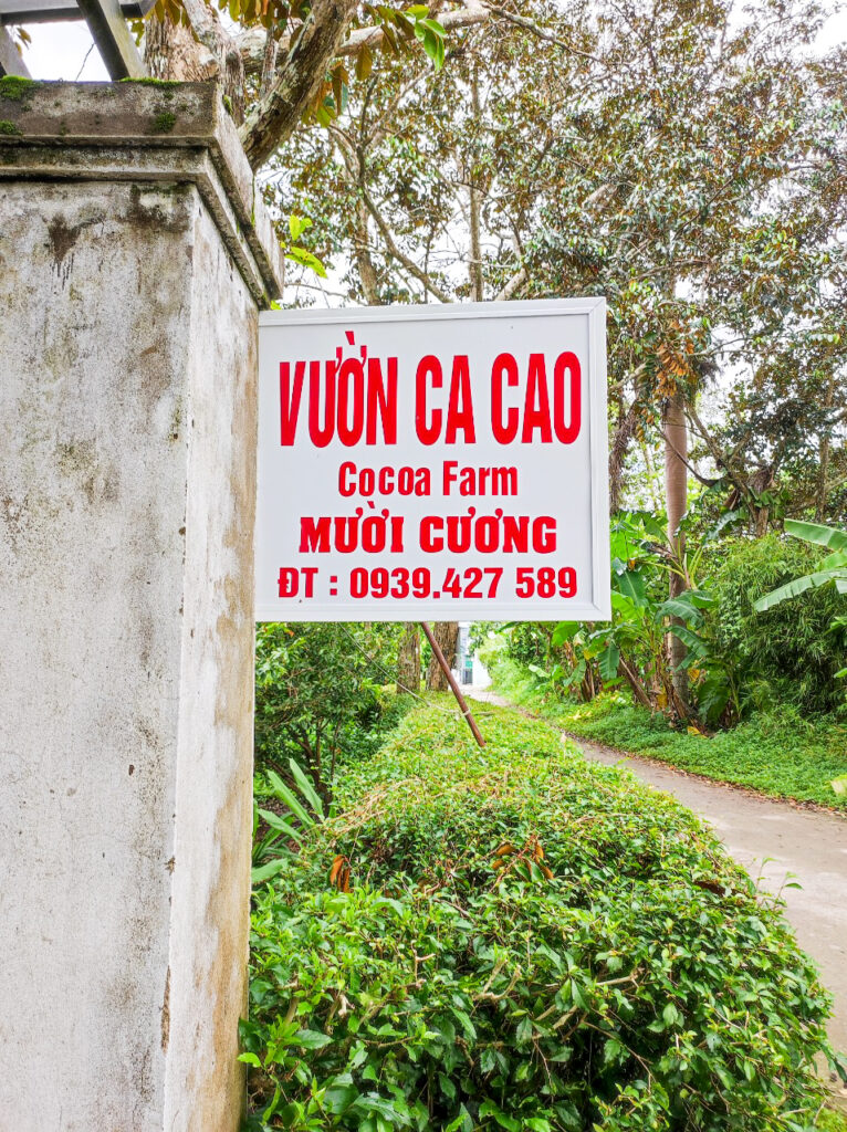 The entrance to Muoi Cuong Cacao Farm Can Tho with phone number